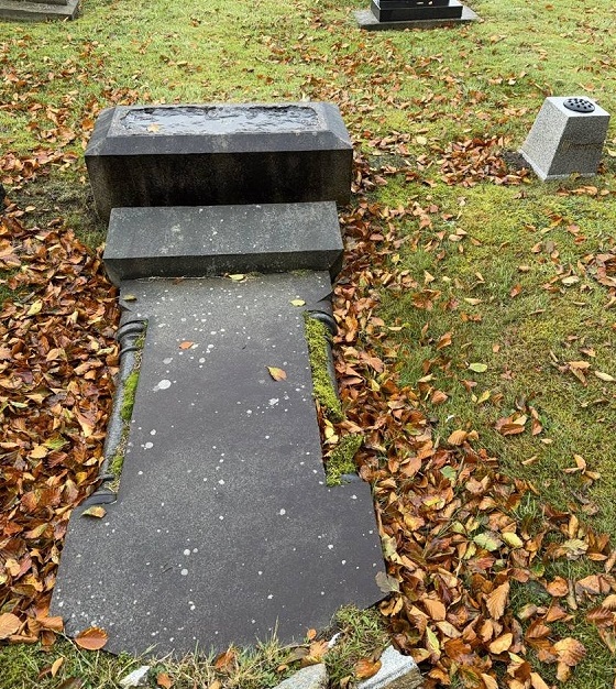 A toppled gravestone in a UK graveyard